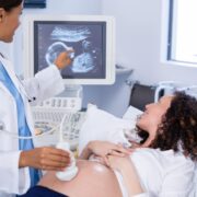 Doctor doing ultrasound scan for pregnant woman ultrasounds